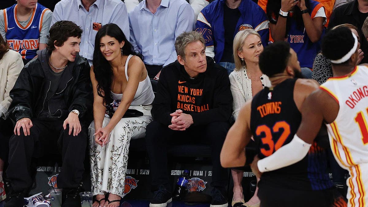 Timothée Chalamet and Kylie Jenner seated at Madison Square Garden during an NBA playoff game.