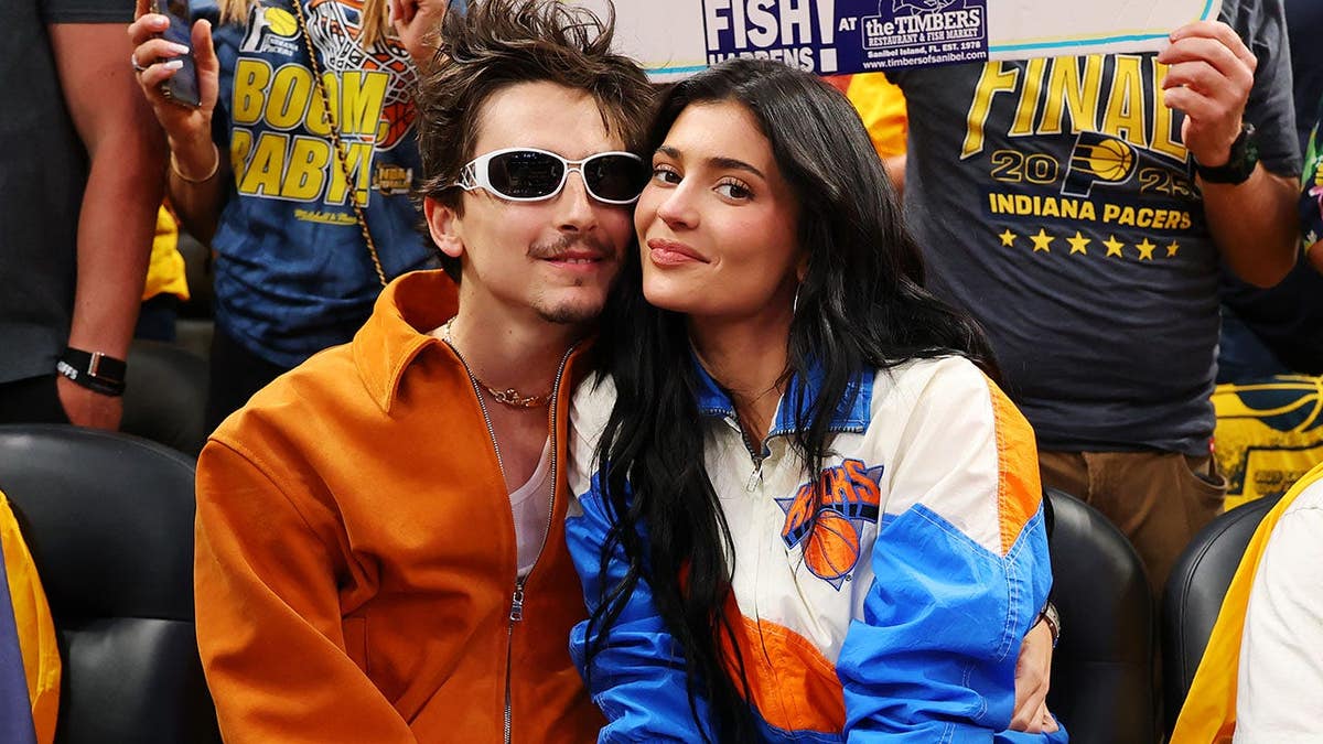 Timothee Chalamet and Kylie Jenner sit courtside during an NBA playoff game.