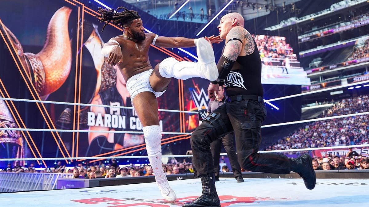 Trick Williams wrestles Baron Corbin at U.S. Bank Stadium.