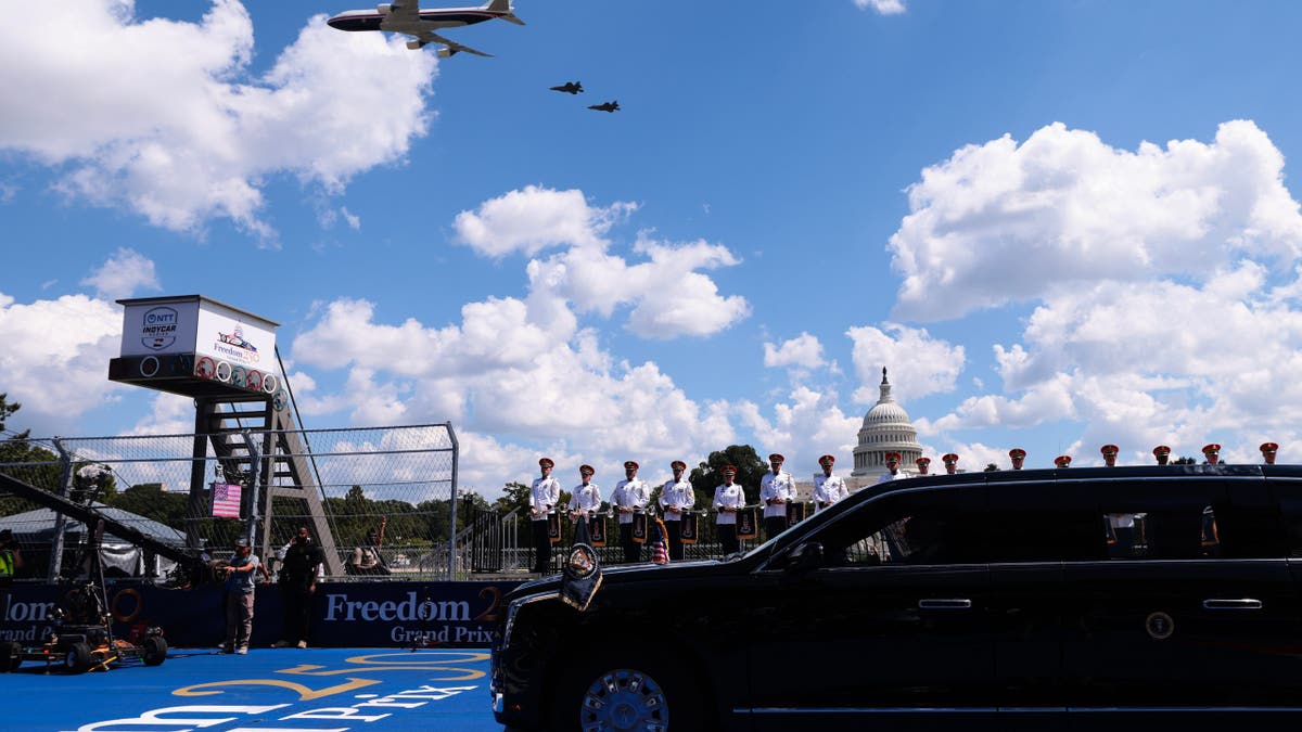 Donald Trump and Melania Trump ride in The Beast during a military flyover in Washington, D.C.