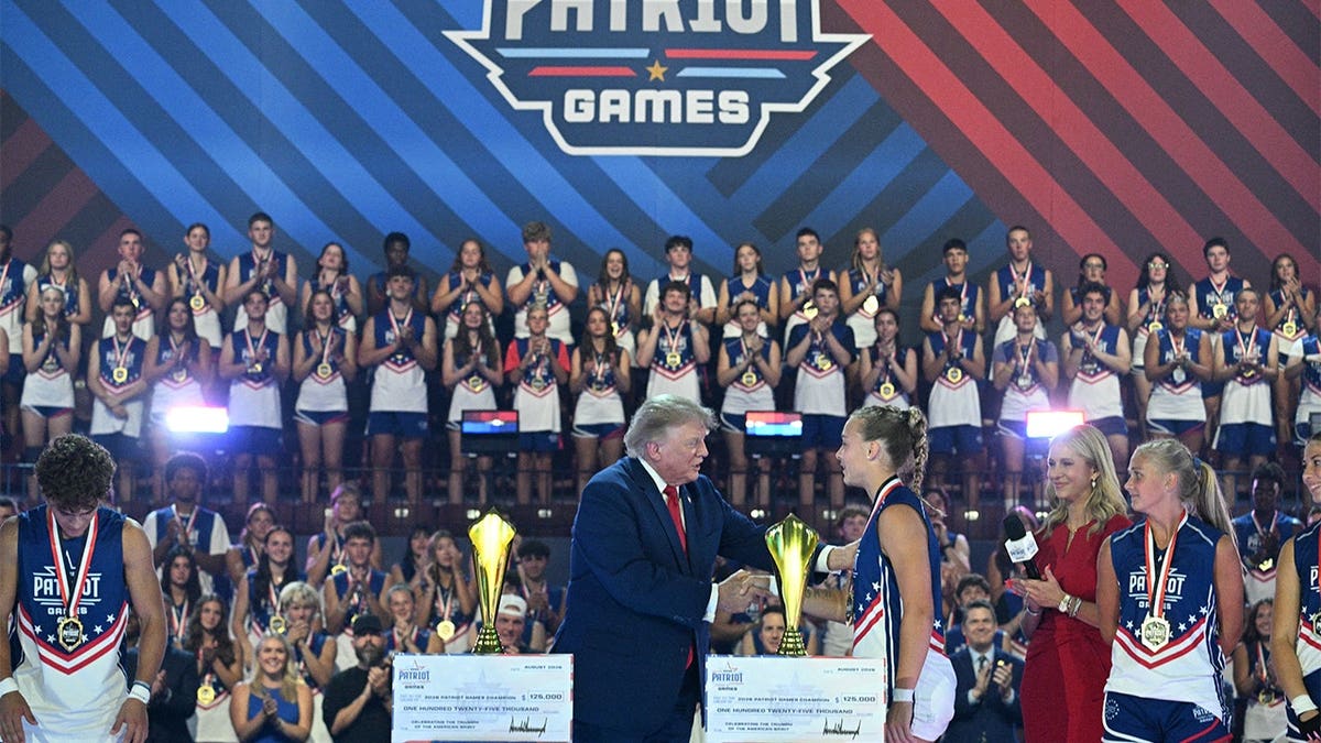 Donald Trump greets winning participants on stage at the Patriot Games finals in Geneva, Ohio.