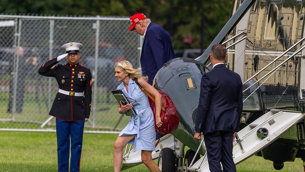 Donald Trump and Natalie Harp step off Marine One near the White House.