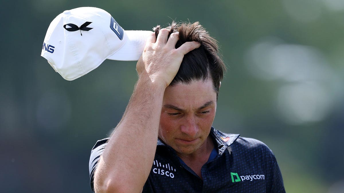 Viktor Hovland reacts on the ninth tee at East Lake Golf Club.