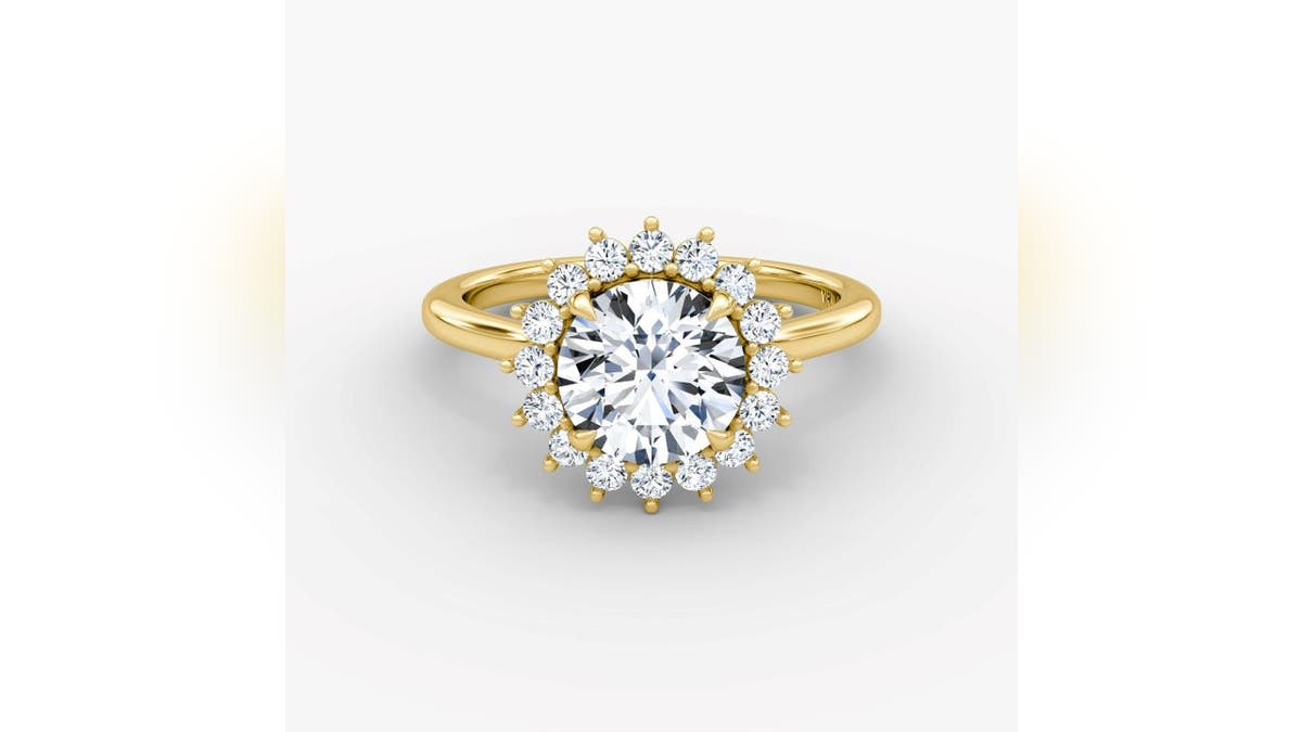 Gold and diamonds combine to create a sun-like ring.