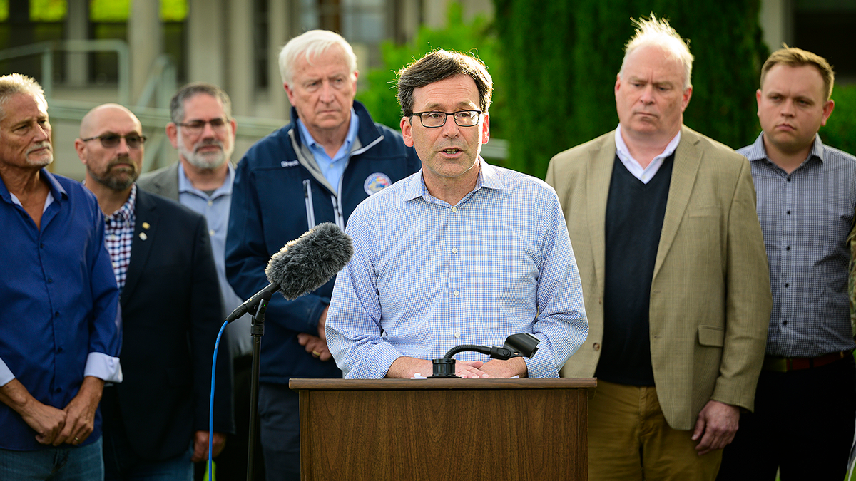 Washington Gov. Bob Ferguson speaks during an outdoor press conference