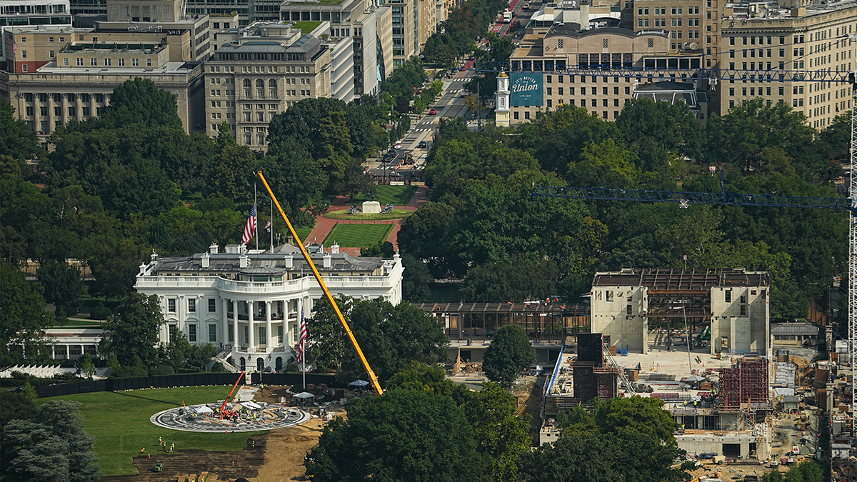 A view of the ongoing construction of a helipad and ballroom (R) at the White House, as seen from the Washington Monument observation deck in Washington, DC on August 28, 2026.