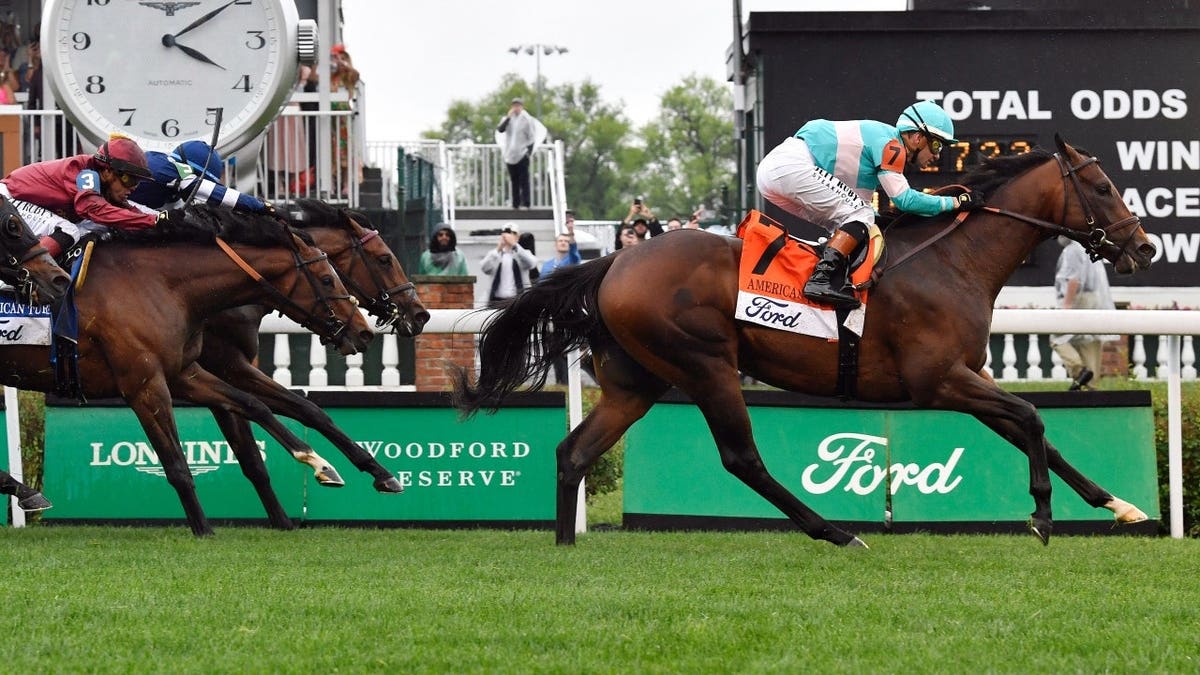 Zulu Kingdom, with jockey Flavien Prat up, leads the pack past the finish line to win the 2025 American Turf at Churchill Downs in Louisville, Kentucky.