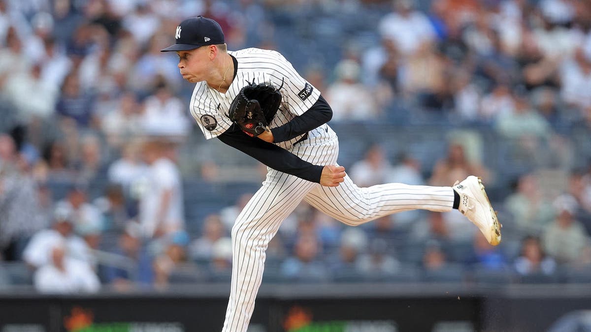 Will Warren, New York Yankees starting pitcher, follows through on a pitch at Yankee Stadium.