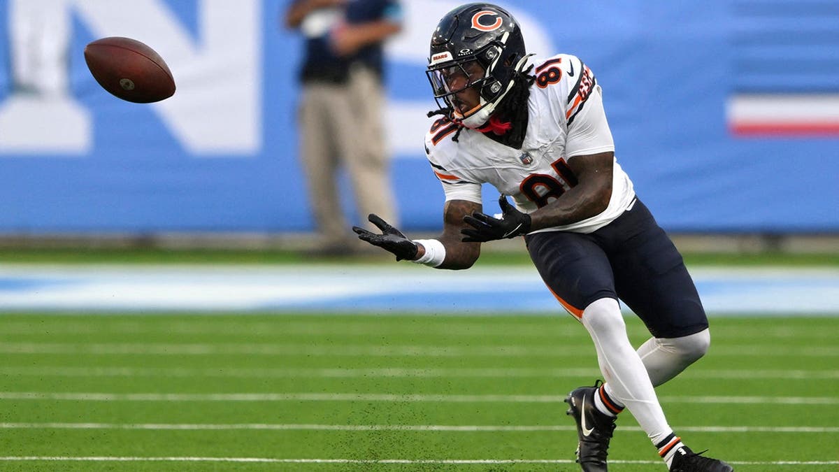 Zavion Thomas, wearing number 81, makes a catch against the Tennessee Titans.