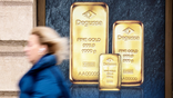 A poster depicting investment gold bars is seen on a gold dealer's window in Madrid, on January 30, 2026.