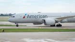 American Airlines passenger plane taxis on an airport runway