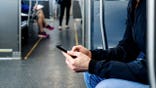 Hands hold phone