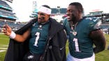 Jalen Hurts and A.J. Brown react after winning an NFL game