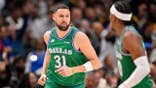 Klay Thompson plays for the Mavericks in a game against the Lakers