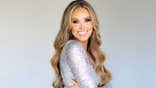 Jade Kircus wearing a sparkling silver dress and smiling.