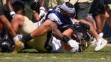 Dallas Cowboys outside linebacker Sam Williams, top, fight with New Orleans Saints tight end Moliki Matavao during an NFL football joint practice, Tuesday, Aug. 18, 2026, in Oxnard, Calif. Credit: Mark J. Terrill/AP Photo