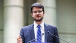 U.S. House candidate William Lawrence speaks at a rally with U.S. Senate candidate Abdul El-Sayed, U.S. Sen. Bernie Sanders and U.S. Rep. Alexandria Ocasio-Cortez in Lansing, Mich., on July 19, 2026.