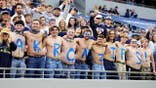Akron Zips fans sit in the stands during a college football game.