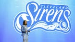 Allison Howard helps reveal the Cleveland Sirens WNBA team name and logo at Rocket Arena.