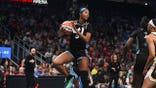 Angel Reese grabs a rebound during a WNBA game in Atlanta.