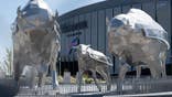 Bison sculptures sit in Family Circle outside Highmark Stadium.