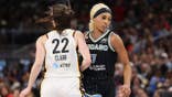 Caitlin Clark and DiJonai Carrington collide during a basketball game at Wintrust Arena.