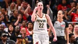 Caitlin Clark #22 celebrates during a game against the Atlanta Dream.