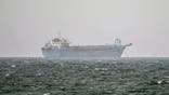 A vessel near Strait of Hormuz is anchored off the coast of Sharjah, United Arab Emirates