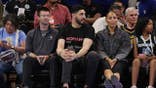 Enes Kanter Freedom looks on courtside during a Chicago Sky and Indiana Fever basketball game.