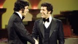 Engelbert Humperdinck and Tom Jones shake hands.