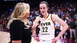 Holly Rowe interviews Caitlin Clark #22 after the game.