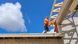 Workers install roofing for a new home under construction in Palm Beach Gardens, Florida, US, on Monday, June 29, 2026.