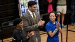 omar, piker, hong at rally clapping