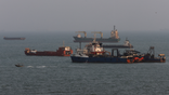 Ships are anchored in the Strait of Hormuz