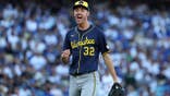 Jacob Misiorowski #32 strikes out Max Muncy #13 during Game 3 of the National League Championship Series.