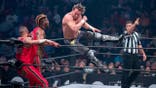 Kenny Omega and Adam Page wrestle against Private Party in a tag-team match.