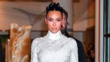 Kim Kardashian walking in white dress