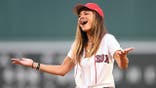 Maria Menounos reacts after throwing a ceremonial first pitch at Fenway Park.