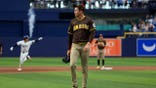 Mason Miller reacts as Jonny DeLuca hits a home run at Tropicana Field.