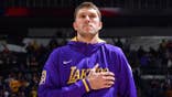Matt Ryan stands during the National Anthem before a Lakers game.