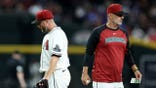 Merrill Kelly #29 is removed by Arizona Diamondbacks manager Torey Lovullo #17 during an MLB game.