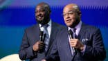 Mike Tomlin and Mike Tirico stand together at Radio City Music Hall.