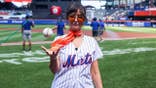 Milana Vayntrub poses for a photo before delivering the ceremonial first pitch at Citi Field.