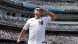 Nick Swisher stands at Yankee Stadium during Old-Timers' Day.
