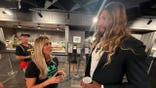 Riley Gaines and Royce White talk in Indianapolis during halftime of a WNBA game between the Indiana Fever and the Connecticut Sun about how important it is to keep women's sports for biological women.