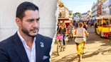 El-Sayed next to a photo of Mackinac Island