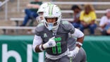 Solomon Beebe runs a play during a college football game