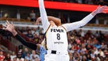 Sophie Cunningham drives to the basket as DiJonai Carrington fouls her during an Indiana Fever vs. Chicago Sky game.