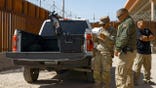 Texas National Guard member and Border Patrol agent operate a surveillance drone at the U.S.-Mexico border.