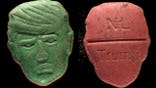 Pills with President Donald Trump depicted on one side and NL and Trump stamped on the other.